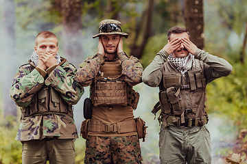 Image showing Group of soldiers in oposit sides celebrating peace after battle by showing blind mute and deaf symbols