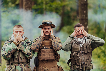 Image showing Group of soldiers in oposit sides celebrating peace after battle by showing blind mute and deaf symbols