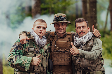 Image showing Group of soldiers in oposit sides celebrating peace after battle