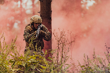 Image showing Battle of the military in the war. Military troops in the smoke