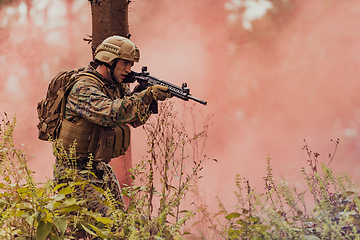 Image showing Battle of the military in the war. Military troops in the smoke