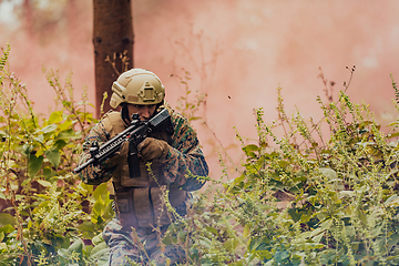 Image showing Battle of the military in the war. Military troops in the smoke