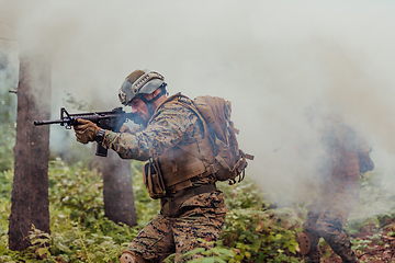 Image showing Battle of the military in the war. Military troops in the smoke