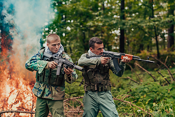 Image showing Angry terrorist militant guerrilla soldier warrior in forest