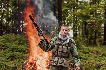 Image showing Angry terrorist militant guerrilla soldier warrior in forest