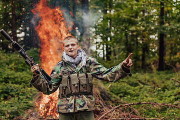 Image showing Angry terrorist militant guerrilla soldier warrior in forest