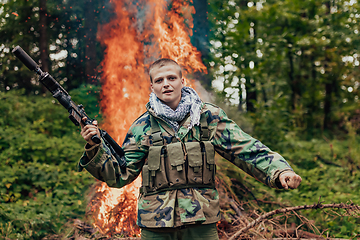 Image showing Angry terrorist militant guerrilla soldier warrior in forest