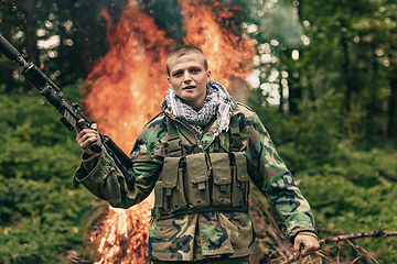 Image showing Angry terrorist militant guerrilla soldier warrior in forest