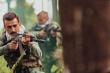 Image showing Angry terrorist militant guerrilla soldier warrior in forest