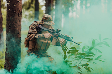 Image showing A modern warfare soldier on war duty in dense and dangerous forest areas. Dangerous military rescue operations