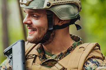 Image showing A modern warfare soldier on war duty in dense and dangerous forest areas. Dangerous military rescue operations