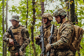 Image showing Modern warfare Soldiers Squad Running as Team in Battle Formation