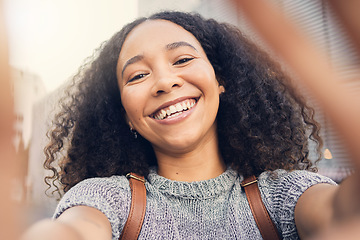 Image showing Happy, selfie and portrait of a woman in the city for exploring or sightseeing on weekend trip. Social media, smile and face of African young female person from Mexico taking a picture in urban town.