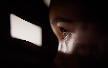 Image showing .Peep, hole and eye to spy for security or face at the window looking in the dark, shadow or neighbour with a peephole in a door. Anxiety, watching or eyes of person in apartment, home or house.