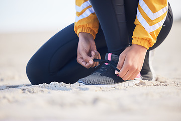 Image showing Beach, closeup and woman tie laces for an outdoor run for fitness, health and wellness by seaside. Sports, athlete and zoom of female runner preparing for a cardio workout or exercise by the ocean.