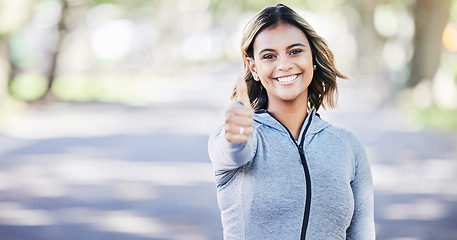 Image showing Runner woman, thumbs up and portrait in park, smile or exercise in fitness training in nature. Indian girl, happy and hand for sign language, health or workout for body, wellness or success with goal