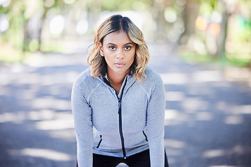 Image showing Runner woman, portrait and ready in park, mindset and exercise for fitness training in nature. Indian girl, commitment and pride for wellness, health or outdoor workout for body, self care and goals