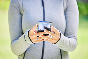 Image showing Fitness, search and phone with hands of woman in nature for running, tracker and social media. Marathon, communication and training with closeup of runner in park for health, online and technology