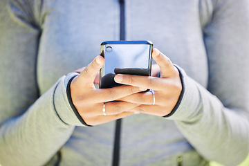 Image showing Fitness, app and phone with hands of woman in nature for running, tracker and social media. Marathon, communication and training with closeup of runner in park for health, online and technology