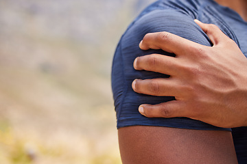 Image showing Sports man, runner and shoulder pain from workout training injury or fitness cardio running accident outdoor. Hand, arm muscle or closeup of injured male athlete with exercise emergency in nature