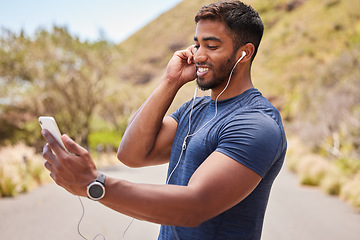Image showing Fitness, happy man or runner with music on mobile app online in training, workout or exercise on road. Headphones, radio audio or healthy athlete listening or streaming podcast to start running