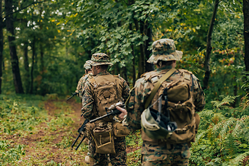 Image showing Modern warfare Soldiers Squad Running as Team in Battle Formation