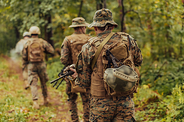 Image showing Modern warfare Soldiers Squad Running as Team in Battle Formation