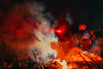 Image showing Soldiers squad in action on night mission using laser sight beam lights military team concept