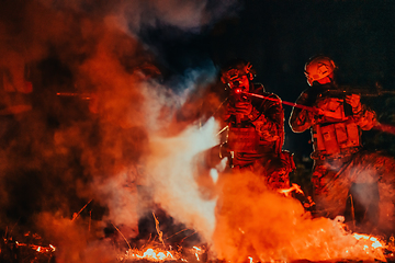 Image showing Soldiers squad in action on night mission using laser sight beam lights military team concept