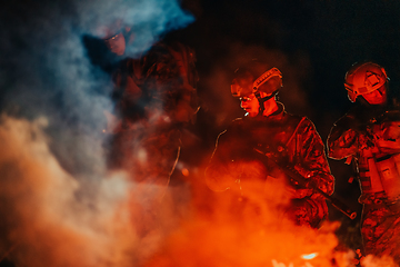 Image showing Soldiers squad in action on night mission using laser sight beam lights military team concept