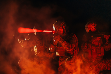 Image showing Soldiers squad in action on night mission using laser sight beam lights military team concept