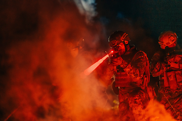 Image showing Soldiers squad in action on night mission using laser sight beam lights military team concept