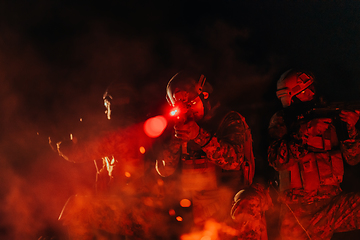 Image showing Soldiers squad in action on night mission using laser sight beam lights military team concept