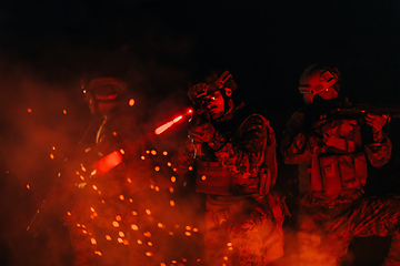 Image showing Soldiers squad in action on night mission using laser sight beam lights military team concept