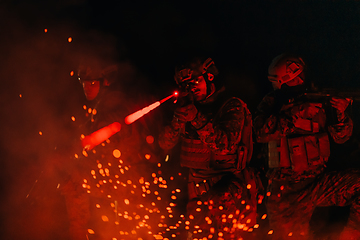 Image showing Soldiers squad in action on night mission using laser sight beam lights military team concept