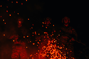 Image showing Soldiers squad in action on night mission using laser sight beam lights military team concept