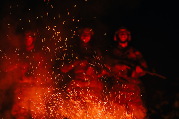 Image showing Soldiers squad in action on night mission using laser sight beam lights military team concept