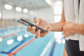 Image showing Phone, hands and athlete at swimming pool with social media, scrolling online or browsing internet after exercise. Swim, sports and person with cellphone for communication after workout or training