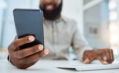 Image showing Business man, hands and typing on smartphone at computer in office for social network, mobile website and digital contact. Closeup of worker reading news, notification and app on cellphone at pc desk