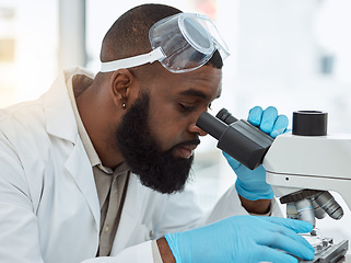 Image showing Microscope, medical science and a man in a laboratory for research, study and analysis or focus. Face of a black person or scientist with a scope for innovation, biotechnology and future development