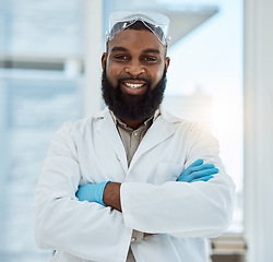 Image showing Laboratory, medical science and portrait of a man for research, study and career pride. Happy black male person or scientist with arms crossed for innovation, biotechnology and future development