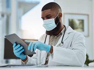 Image showing Doctor, black man and tablet in office for medical review, data research or healthcare app. Hospital physician with face mask planning on digital technology for telehealth, consulting and information
