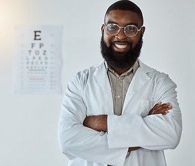 Image showing Eye exam, portrait and black man or doctor with arms crossed and glasses with happy service in healthcare. Ophthalmology, face and expert to check vision, test or assessment for eyes or health