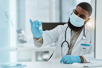 Image showing Medicine, vaccine and a doctor man with a mask for virus protection, health care and cure in hospital. Black person with a pharmaceutical product, vial or container for covid treatment or prevention