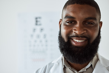 Image showing Optometrist, face and portrait of man with smile with trust for eye care services, healthcare consultation and clinic assessment. Happy African optician with pride for medical analysis of eyes