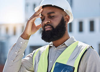 Image showing Construction, man and worker with headache, stress of building renovation and civil engineering mistake. Tired face of confused African contractor in burnout, crisis and industrial problem in city