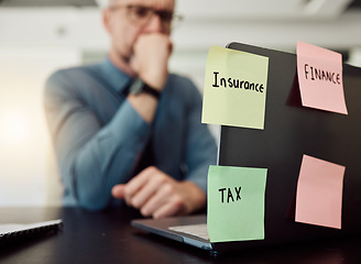 Image showing Insurance, tax and finance on sticky notes with a thinking business man in an office at a desk feeling stress or anxiety. Laptop, accounting audit and an employee worried while working on a computer