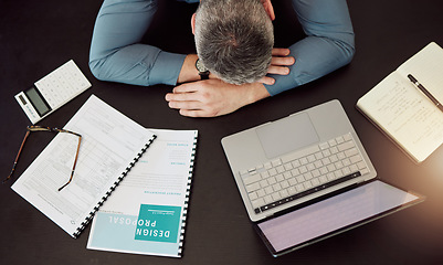 Image showing Business man, sleep and desk in top view with laptop, documents and working overtime for design proposal. Web developer, notebook and computer with fatigue, tired and stress in workplace for deadline