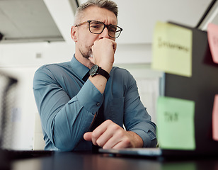 Image showing Stress, insurance and finance with a business man in an office, at his desk while problem solving for bankruptcy. Thinking, accounting or audit with a male employee worried while working on a laptop