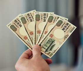Image showing Yen, money fan and hands with cash for banking, trading paper bills and economy of financial freedom. Closeup of rich investor, profit and income of japanese payment, savings and budget of accounting